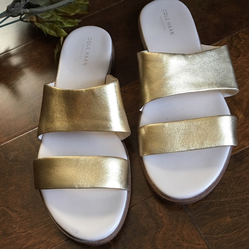 Gold Cole Haan sandals.